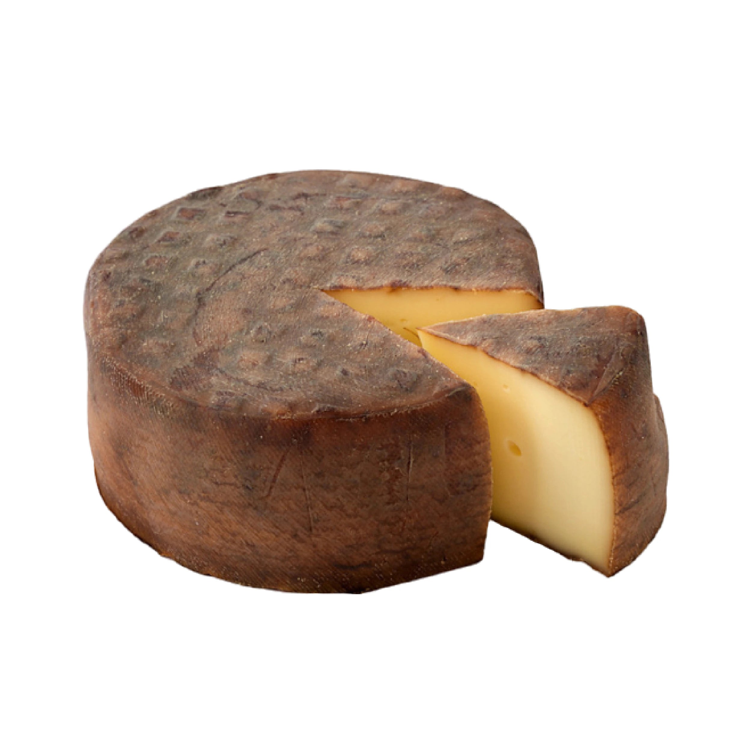 Trappe d’Echourgnac, a creamy cheese with a light flavor and a slightly moist orange rind. Its smooth texture reveals subtle aromas, while the walnut liqueur variant features a soft center and powerful notes of walnut husk, making it ideal for cheese platters.