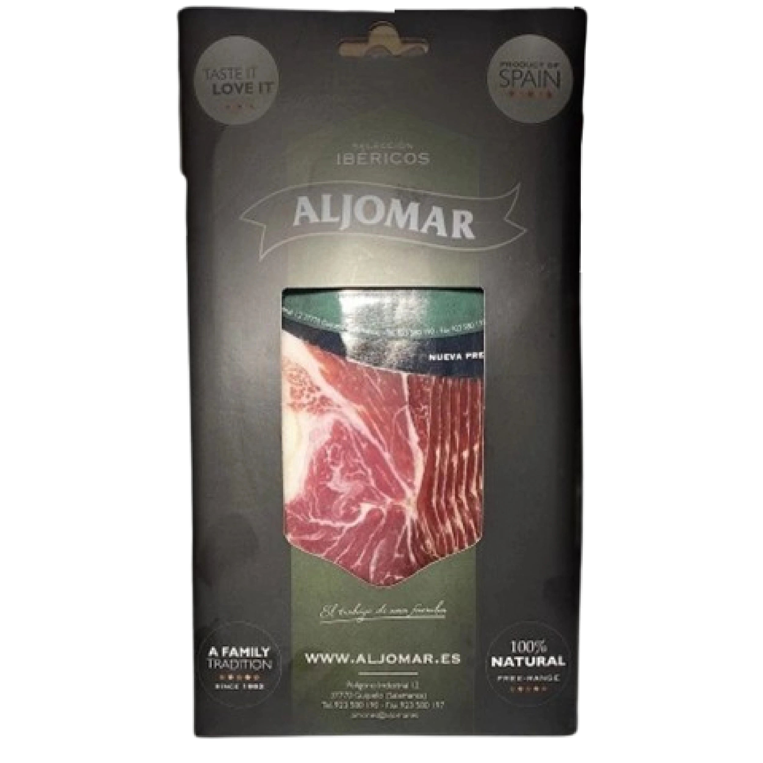 Elegant black packaging of Aljomar Iberian ham. The transparent window in the center reveals bright red, finely marbled ham slices. The Aljomar logo is visible at the top, with "Taste it Love it" and "Product of Spain" mentions on the sides. The packaging highlights the product's "100% Natural" and "A Family Tradition" qualities.