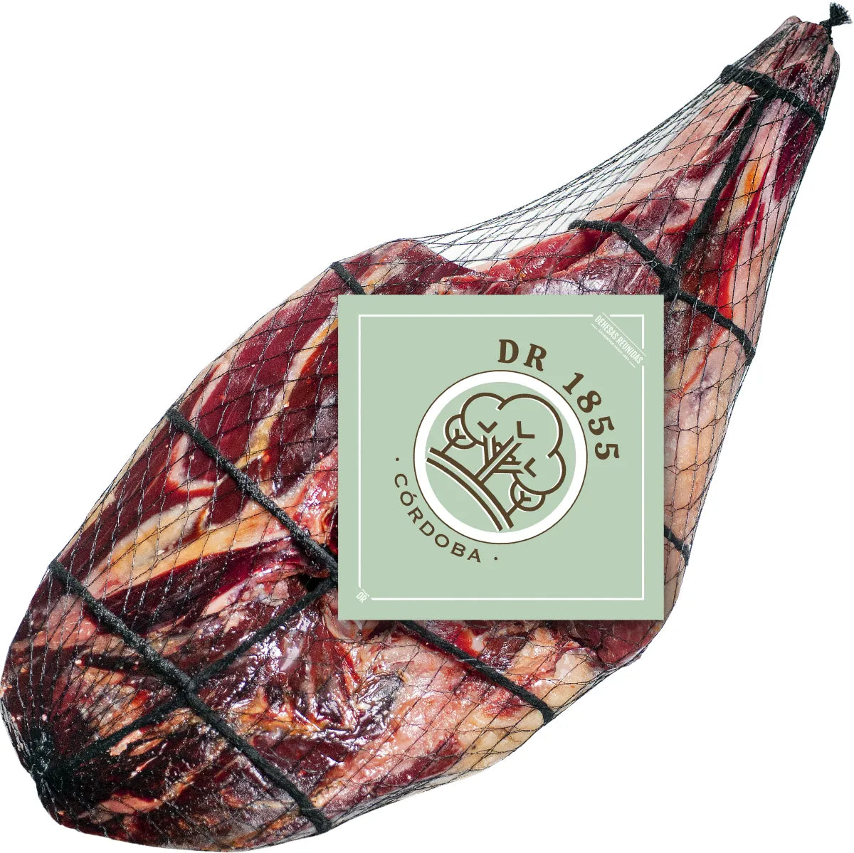50% Ibérico Cebo de Campo Ham from Dehesas Reunidas, dry-cured and sliced thin. Made from free-range Ibérico pigs, it offers a rich, savory flavor with delicate marbling and a tender texture. Perfect for tapas and charcuterie boards.