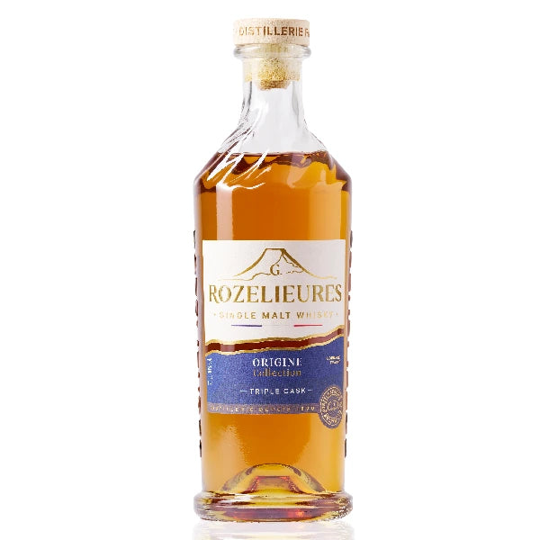 Bottle of Rozelieures Origine Collection whisky, with a white and blue label, containing a golden amber liquid