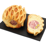 Pistachio sausage in brioche, 250g French gourmet pastry with savory sausage, pistachios, and soft golden brioche crust.