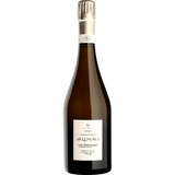 Bottle of Le Noble Les Aventures Grand Cru Brut Champagne, golden hue with fine bubbles, elegant label showcasing French craftsmanship and Grand Cru quality.