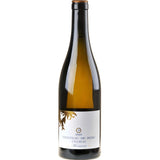 Bottle of Château de Béru Montserre Chablis on a stone background, showcasing its elegant label—pure terroir expression from high-altitude Burgundy vineyards.