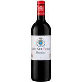 Bottle of Lacoste-Borie Pauillac 2019, the prestigious second wine of Château Grand-Puy-Lacoste. The elegant label adorns a bottle filled with deep ruby-red Bordeaux blend, comprising 62% Cabernet Sauvignon, 29% Merlot, and 9% Cabernet Franc. The bottle stands against a backdrop of sun-drenched Pauillac vineyards, with rows of vines stretching across gravelly soils. The wine's rich color hints at its complex bouquet of black fruits, spices, and subtle oak notes, promising a silky palate with refined tannins