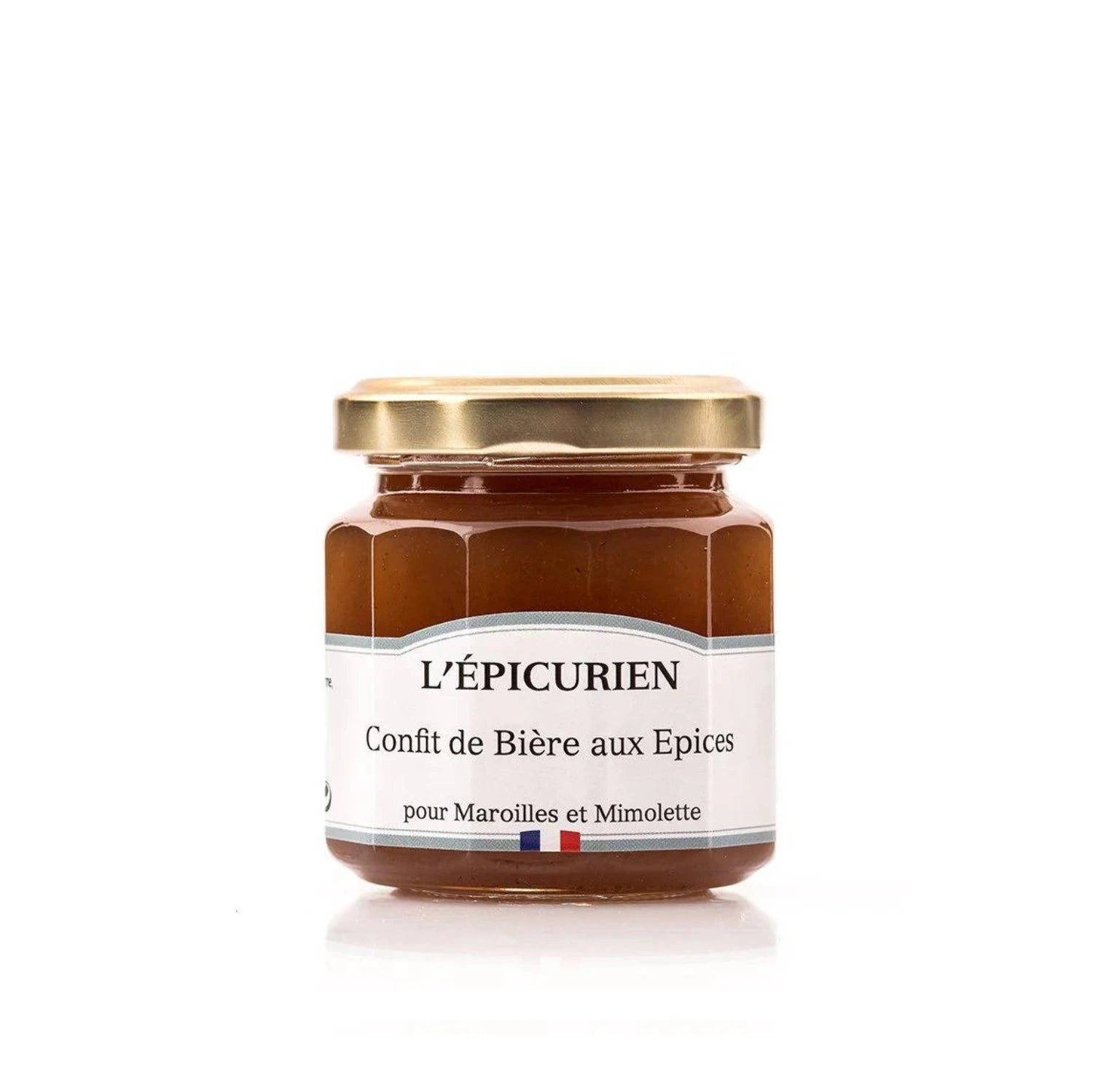 Jar of L'Épicurien's Spiced Beer Confit next to Jenlain amber beer, Maroilles and Mimolette cheeses, showcasing Northern French culinary specialties.