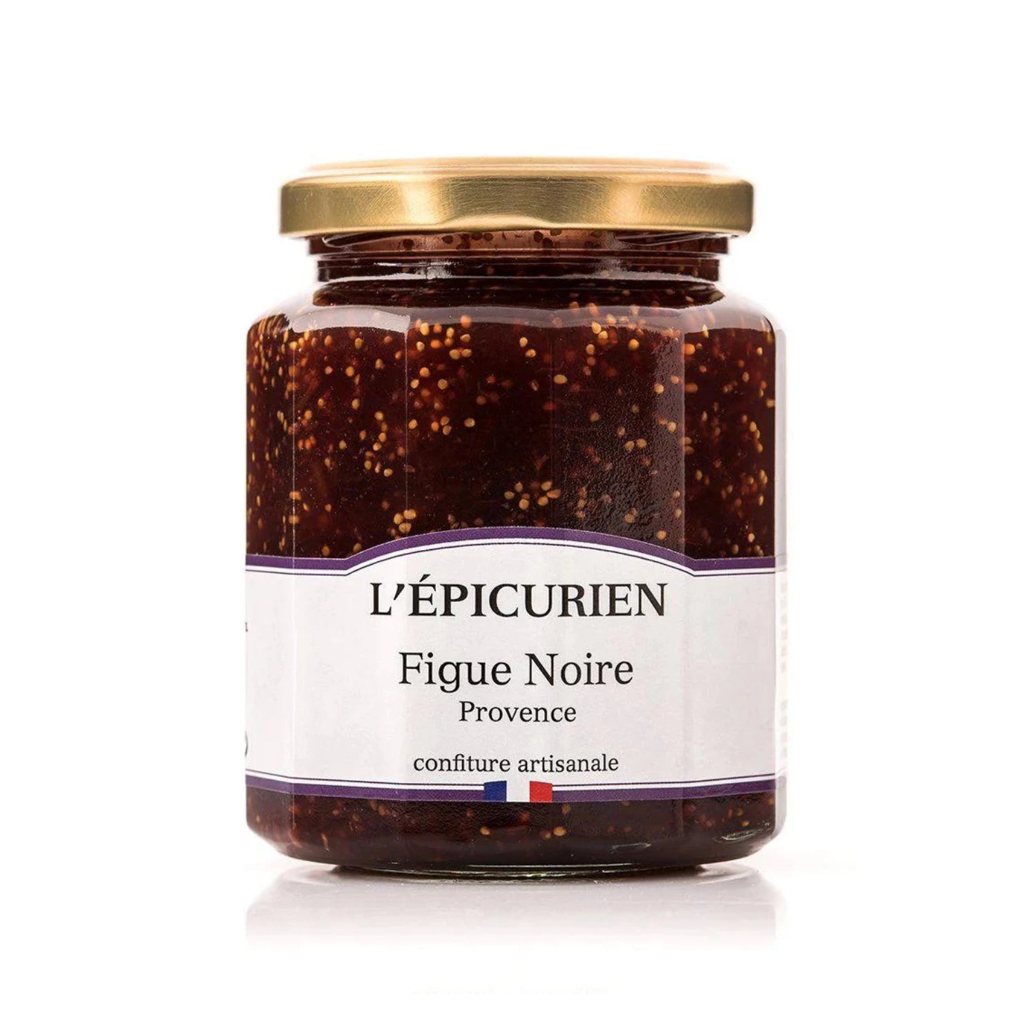 Jar of artisanal Black Fig Jam with fresh figs. Rich, chunky spread on rustic bread and paired with gourmet cheese.