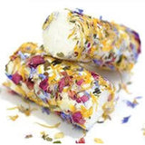 Fresh, creamy goat cheese with a tangy flavor, rolled in edible flowers and herbs. Ideal for elegant appetizers and refined salads.