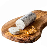 Artisanal Goat Cheese and Truffle Log: creamy and rich, with a delicate truffle aroma. Perfect for gourmet toasts, refined salads, or flavorful pasta dishes.