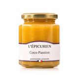 Jar of gourmet Coco Passion Jam with fresh coconut and passion fruits. Creamy tropical spread on toast and croissant.