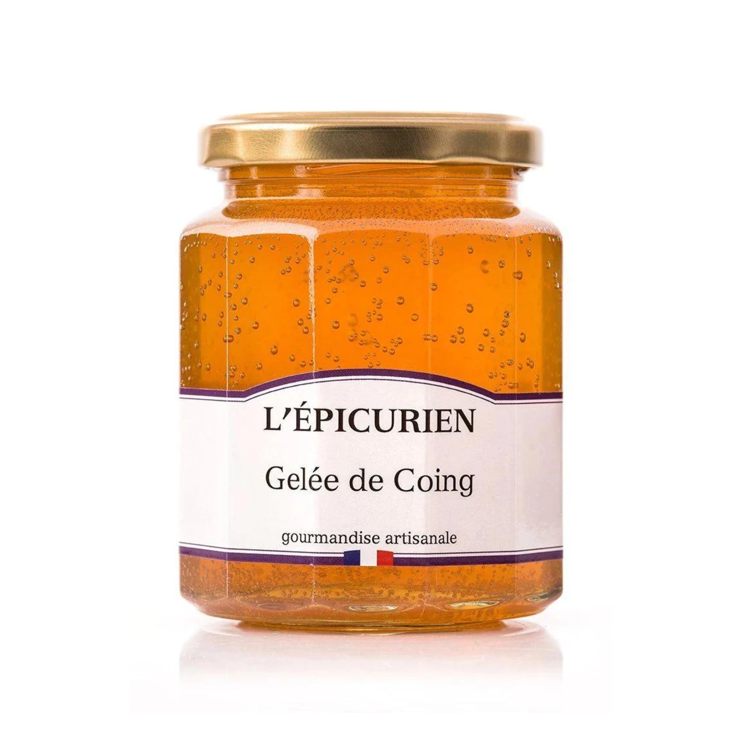 Jar of Artisanal Quince Jelly with smooth, amber-colored spread on rustic bread. Fresh quinces and a gourmet cheese platter nearby, showcasing soft brie and aged cheddar.