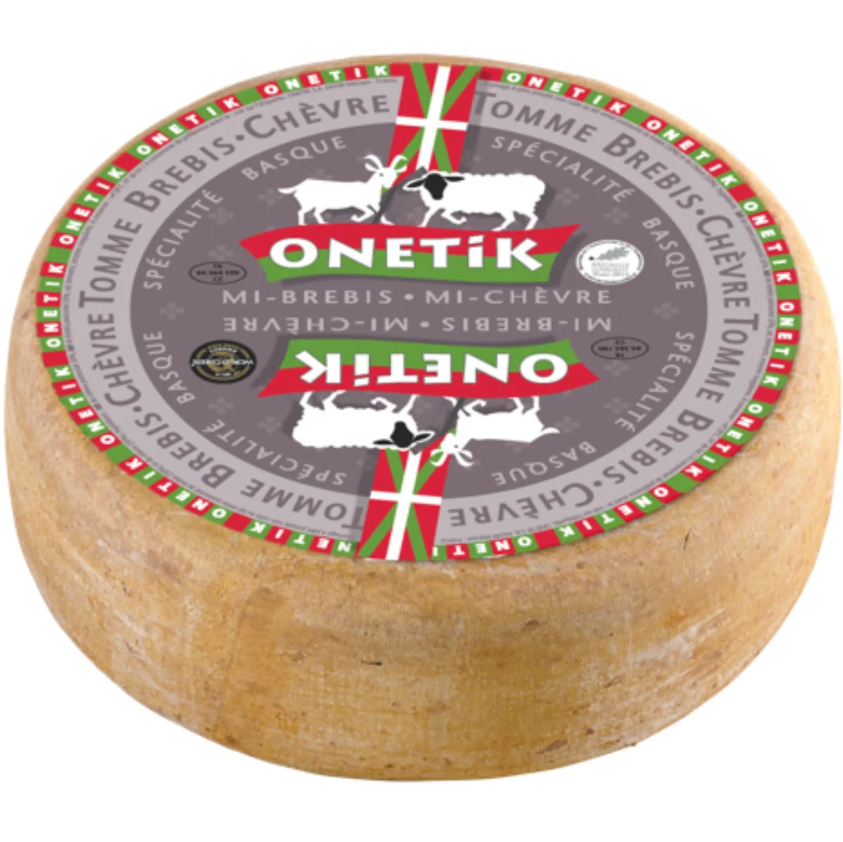 Onetik Tomme Mixte – A rustic Basque cheese wheel made from goat and sheep milk, showcasing a natural rind and firm, marbled interior