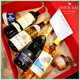 The Explorer’s Gift Hamper featuring four French wines, gourmet terrines, and seafood delicacies, curated by Baron Max Wines for discovery lovers.