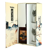 Open Tokinoka gift box, revealing a bottle of Japanese whisky and two whisky glasses, in packaging decorated with stylized Japanese motifs.
