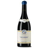 A bottle of Les Homs 2021 from Domaine Cassagne et Vitailles, showcasing a deep garnet color. This wine from the Vin de France appellation is crafted from a proprietary blend, expressing the unique terroir of the Languedoc region. It features a bouquet with notes of pepper, spice, raspberry, cherry, plum, and leather. 