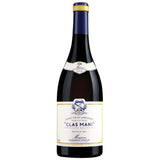A bottle of Clas Mani from Domaine Cassagne et Vitailles, showcasing a deep ruby red color. This wine from the Terrasses du Larzac region is primarily made from Syrah and aged in Chassin barrels. It features a rich and complex bouquet with notes of dark fruits, spices, and subtle oak.
